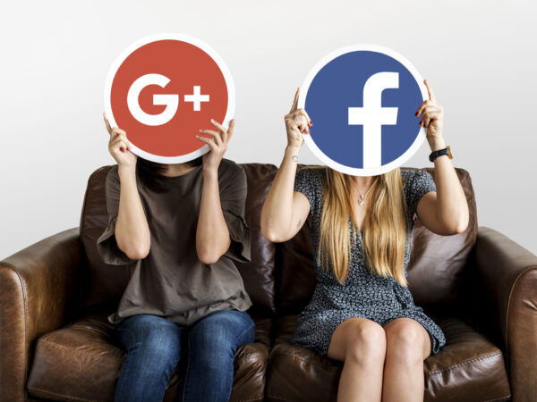 women holding social media icons